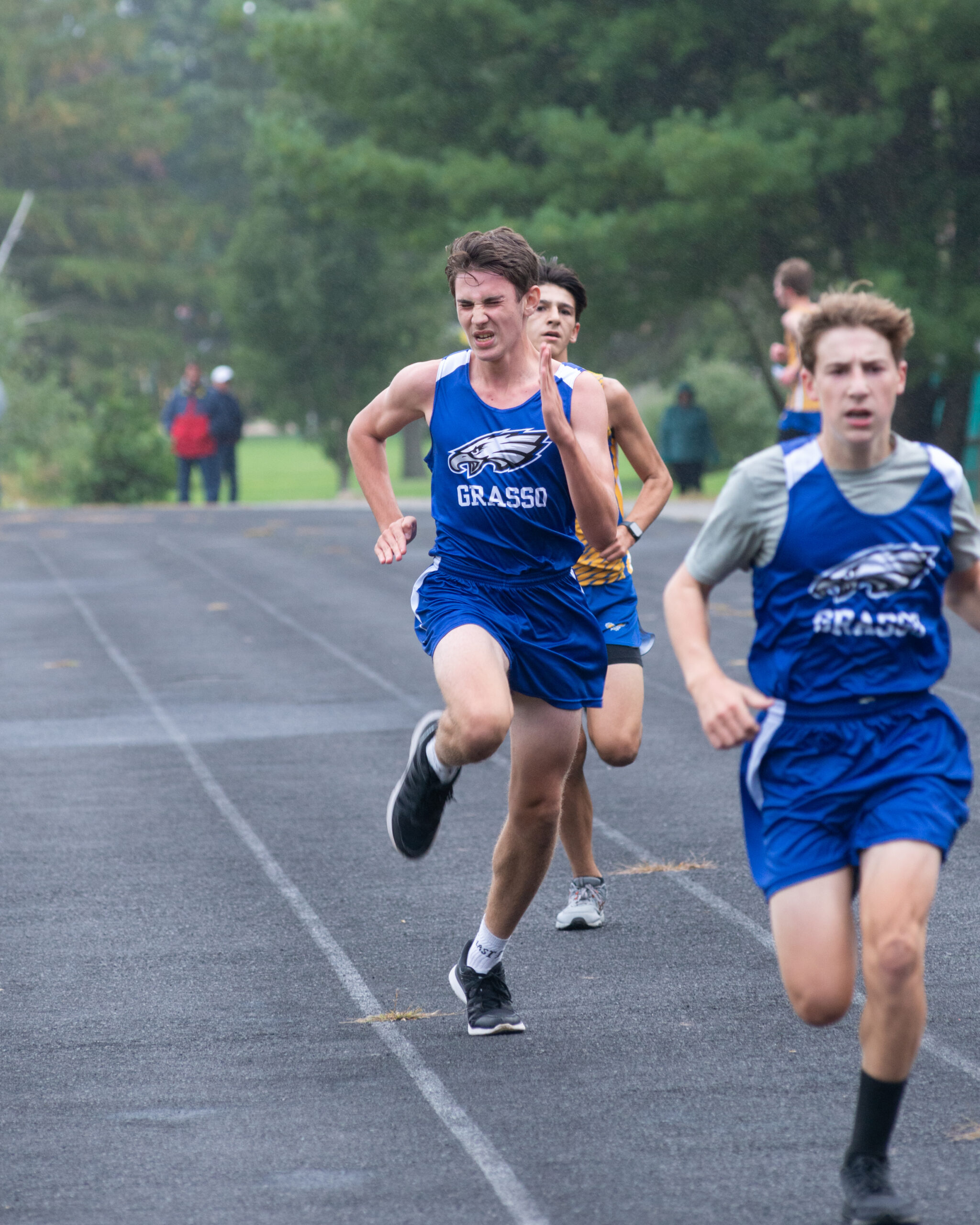 Action shot of runners taking part in a Grasso Tech boys' Cross Country meet.