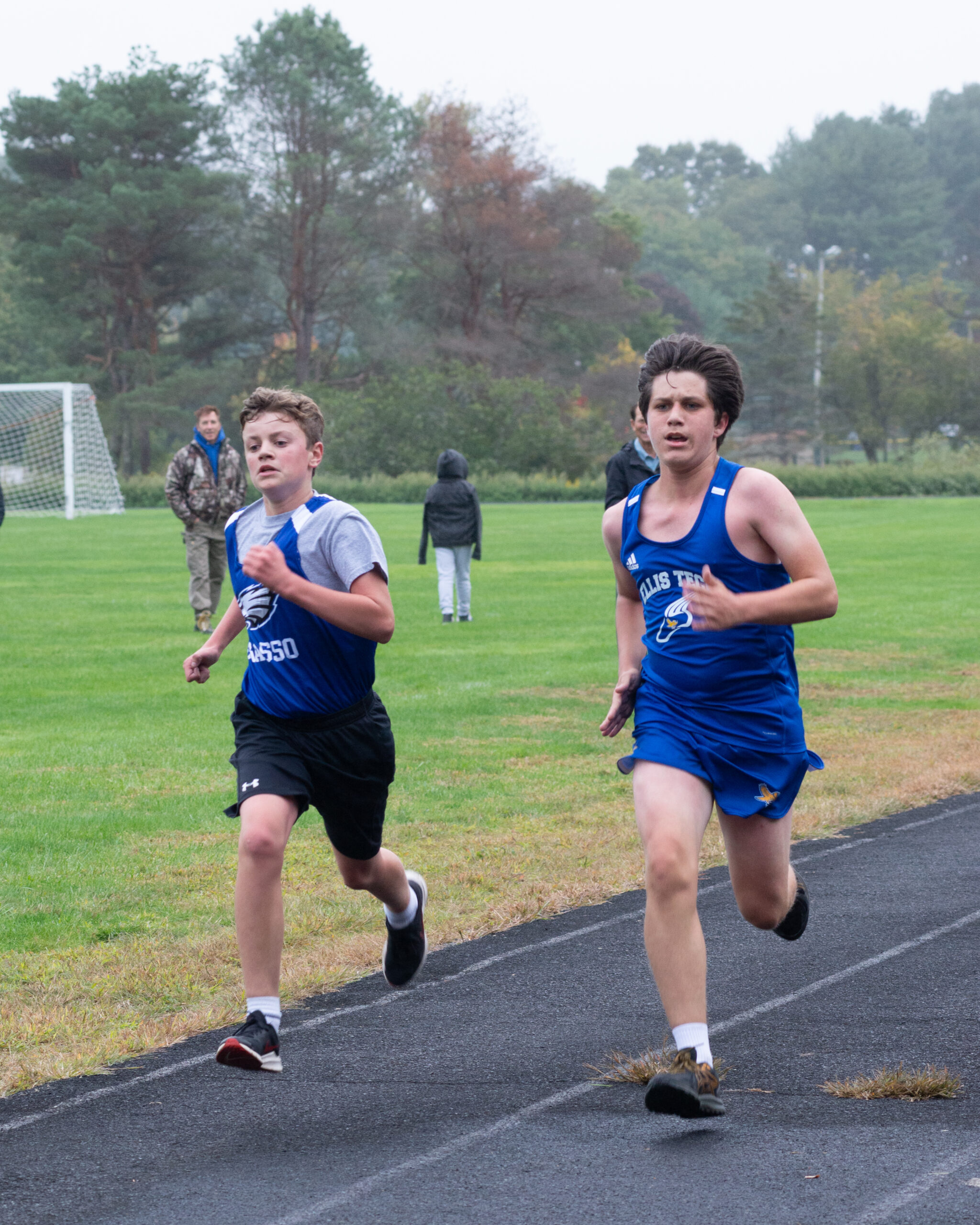 Action shot of runners taking part in a Grasso Tech boys' Cross Country meet.