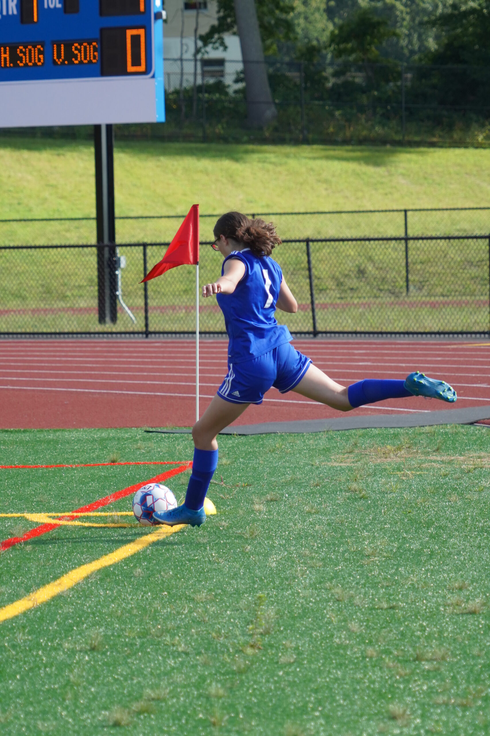 Action shot of a corner kick at a Grasso Tech girls' soccer game