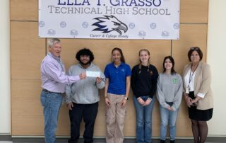 Grasso Tech's Rotary Youth Leadership Awards team (Alex Santiago, Madeline Whittle, Vera Bonville and Olivia Carey receiving a check for their third-place finishing project from Mr. Hurst and accompanied by Principal Feeney.