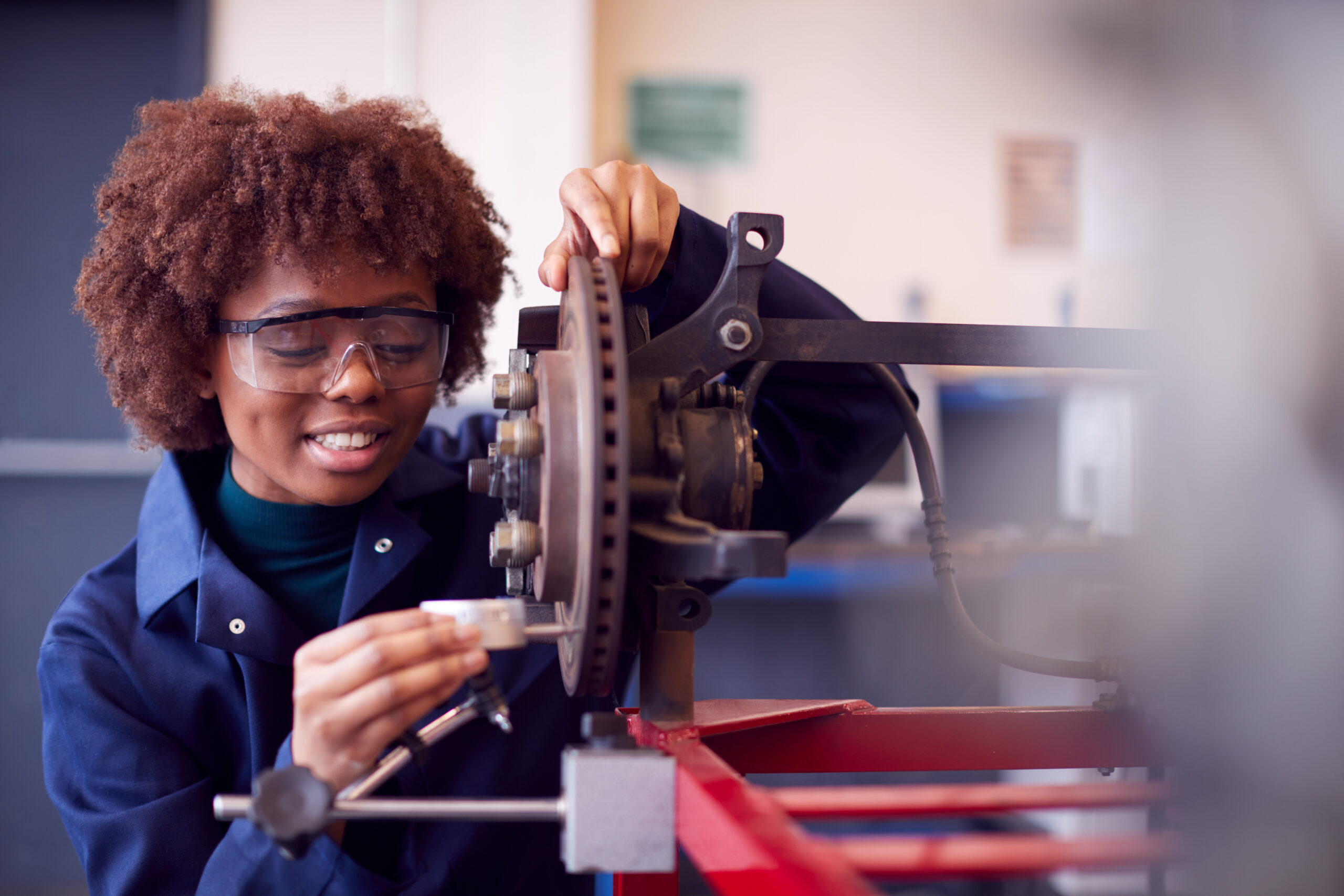 student working on machinery